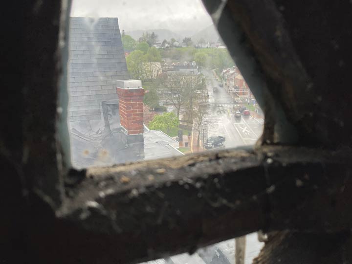 A view through the steeple's window showing some of the arcade roof.