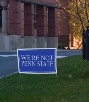 Faked sign saying we're not penn state- a satire sending the same message as penn state lives here.