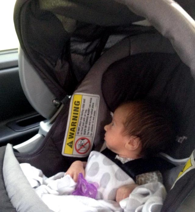 Baby in a car seat.