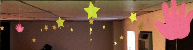 Five-inch wide yellow paper stars hanging from my ceiling.