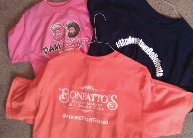 Three tee shirts from local businesses.
